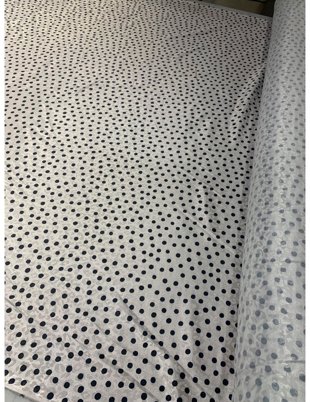 Stretch Polka Dot Fabric imposed over Animal Print